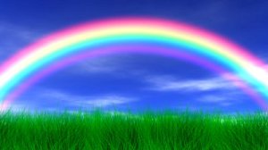 stock-footage-rainbow-grass-and-peaceful-sky